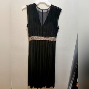 Black dress with beading. New without the tag